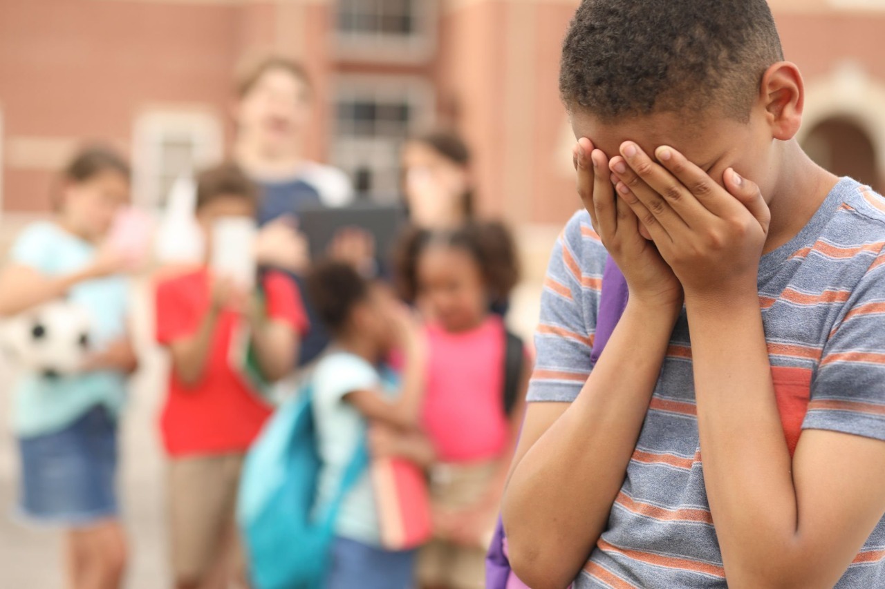 No Bullying Zone billboard at school gate.